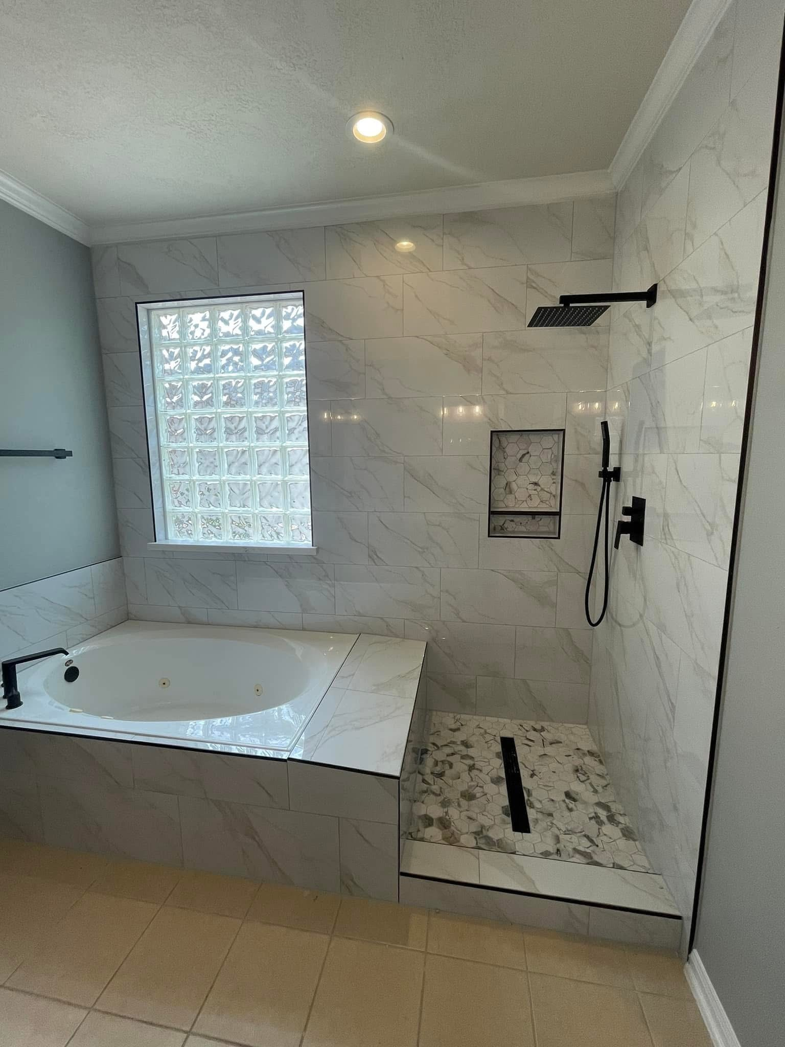 Finished marble master bathroom remodel by Art & Floors